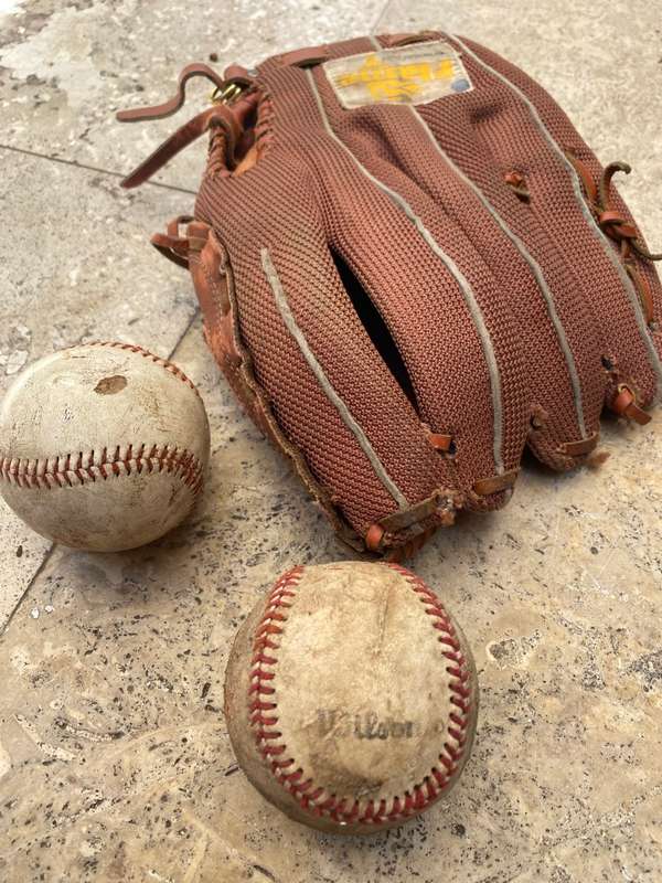 Vintage leather flame baseball  base ball mitt glove and a pair of old Wilson ball balls
