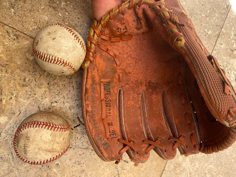 Vintage leather flame baseball  base ball mitt glove and a pair of old Wilson ball balls
