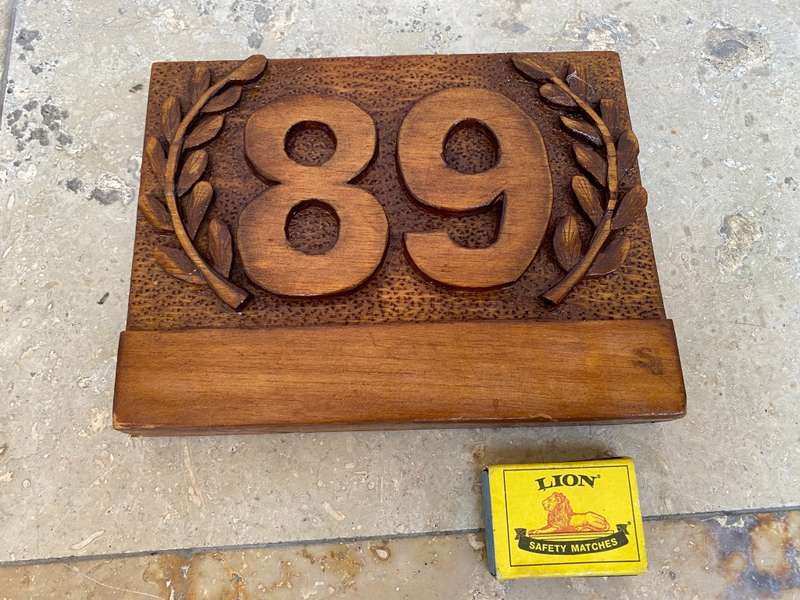 No 89 , no 68 wood carved no plaque