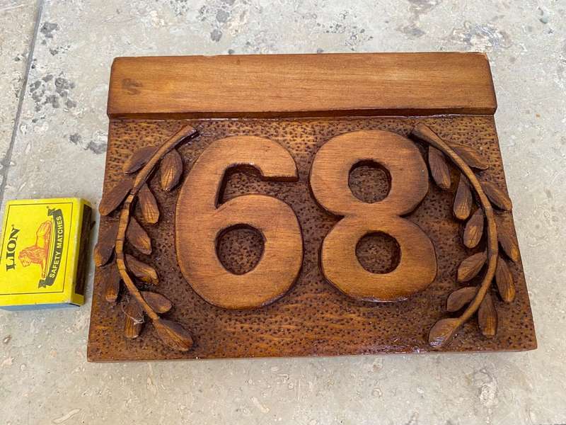 No 89 , no 68 wood carved no plaque