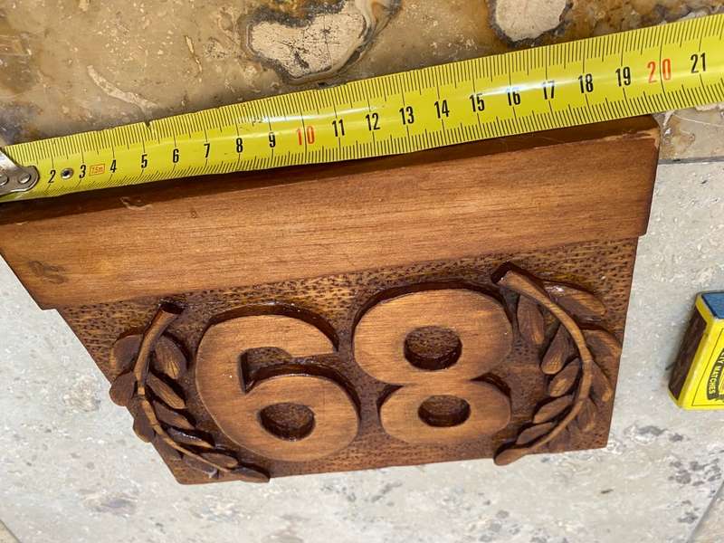 No 89 , no 68 wood carved no plaque