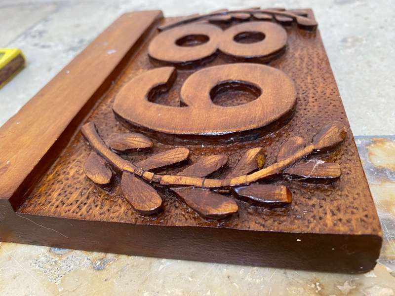No 89 , no 68 wood carved no plaque