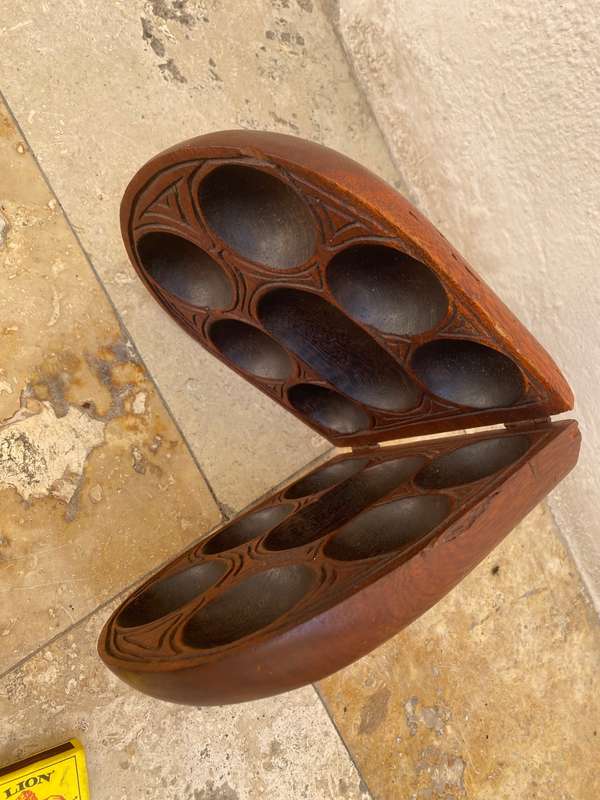 Vintage hand carved wood Mancala Bao game board