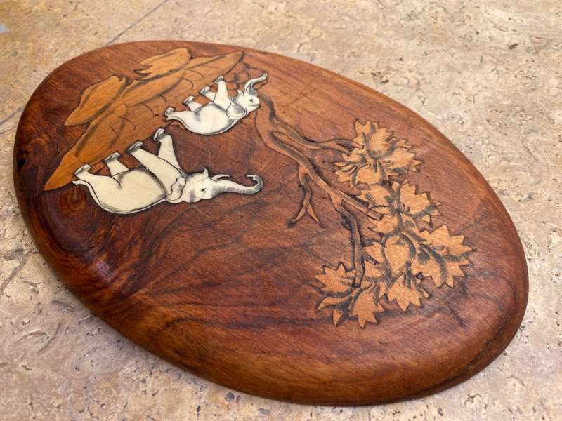 Vintage rosewood inlaid bone elephants made in India wall plaque