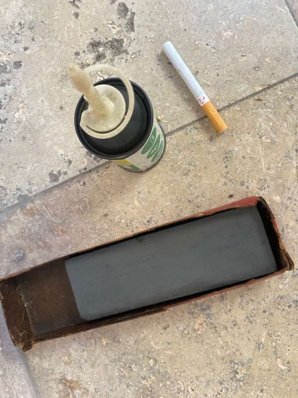 Vintage oil can BP with old sharpening stone