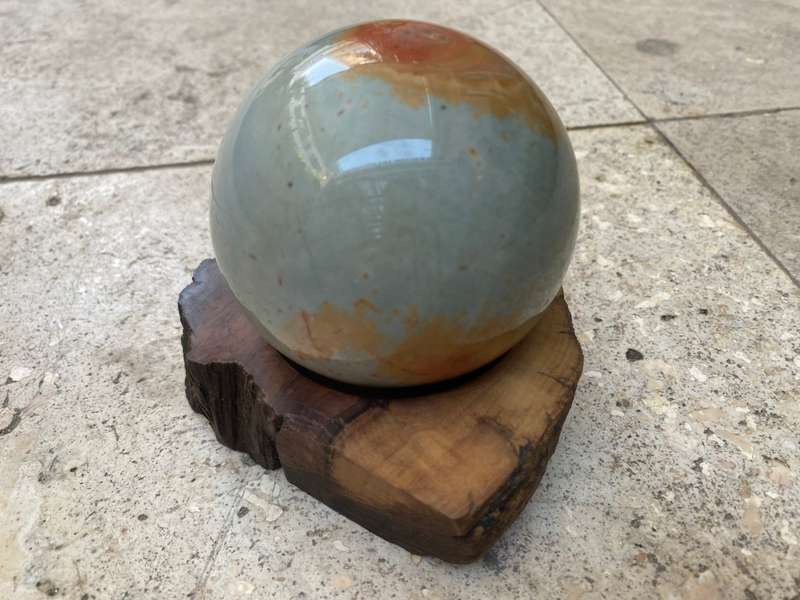 Jasper Polished precious stone sphere 8 cm diameter 24 c, circumference on carved wood base