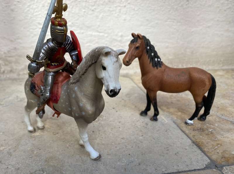 Schleich horse pair with Schleich knight rider figure on black knight medieval horse