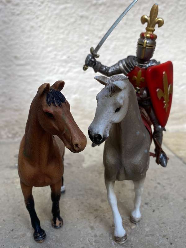 Schleich horse pair with Schleich knight rider figure on black knight medieval horse