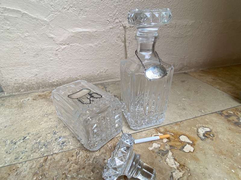 Lead crystal decanter pair with Sterling silver labels vodka and rum