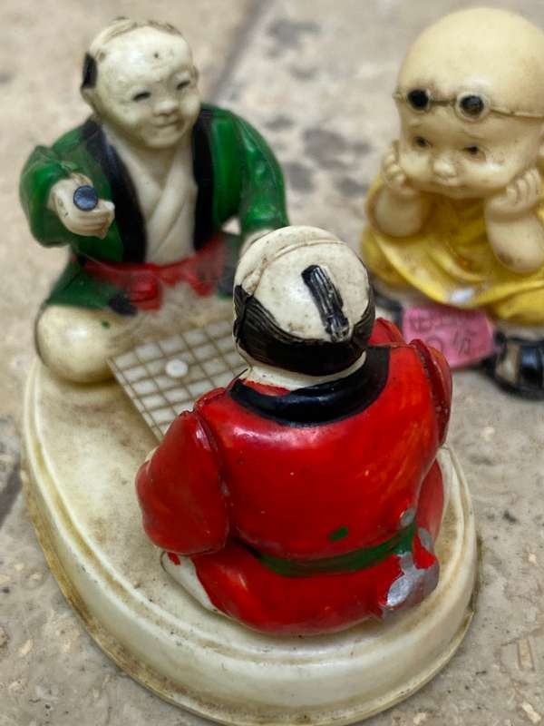 Vintage celluloid Japan miniature scene elders playing with resin baby Buddha