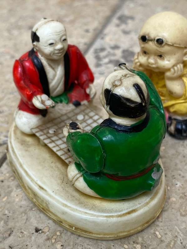 Vintage celluloid Japan miniature scene elders playing with resin baby Buddha