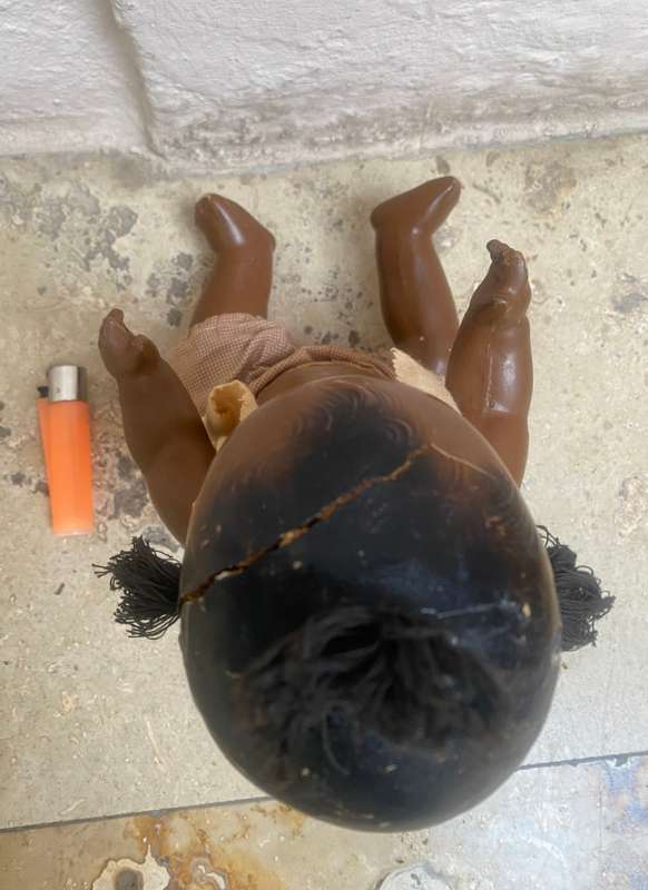 Antique African composition doll plastic