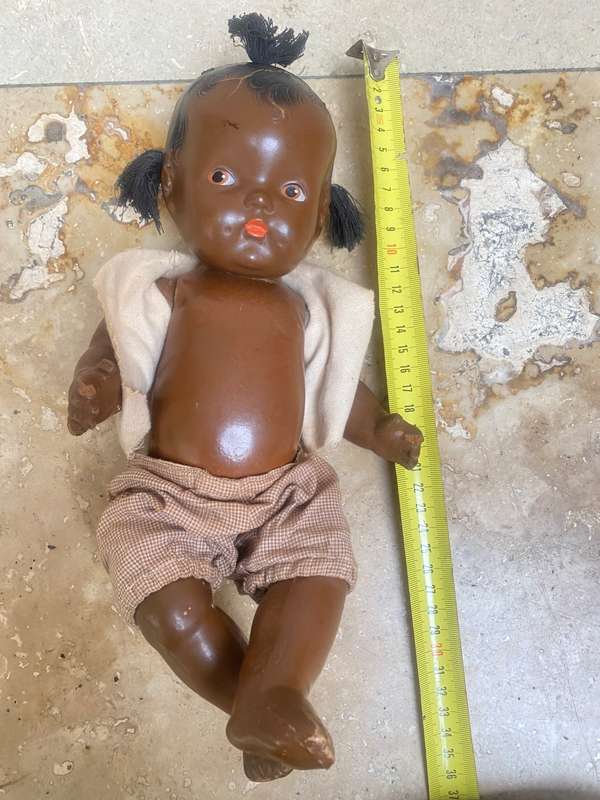 Antique African composition doll plastic