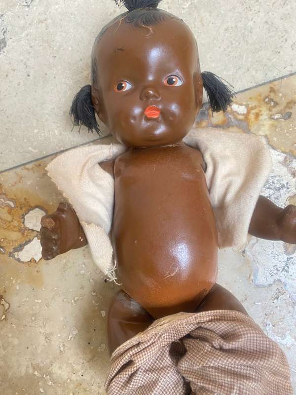 Antique African composition doll plastic