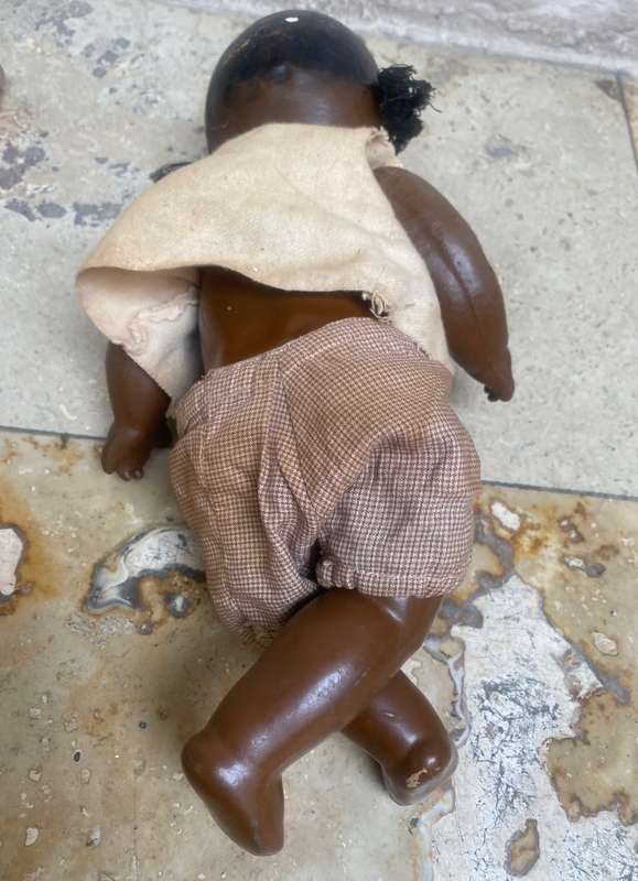 Antique African composition doll plastic