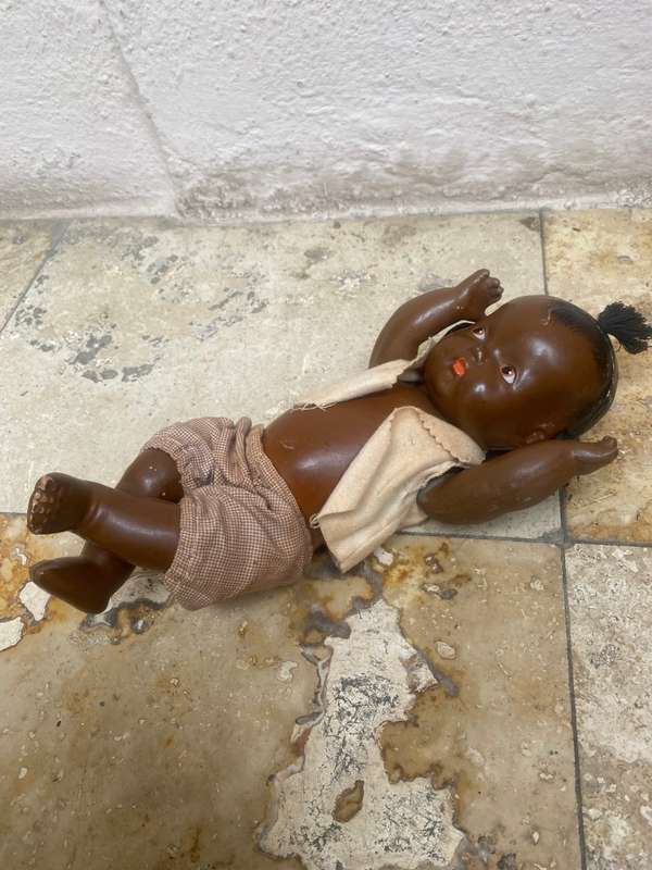 Antique African composition doll plastic