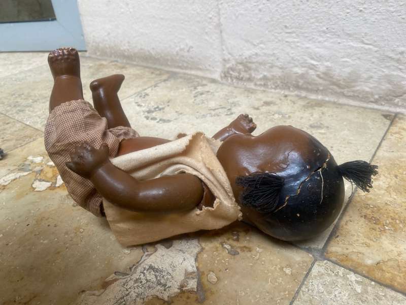 Antique African composition doll plastic