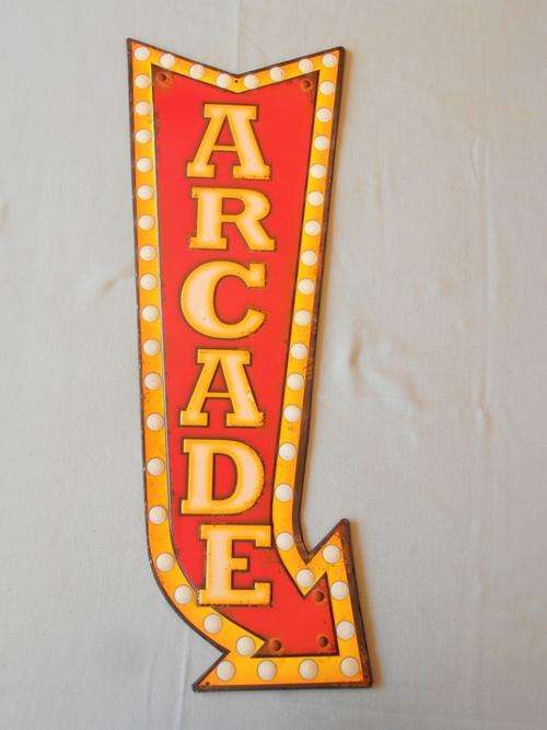 Arcade embossed metal sign