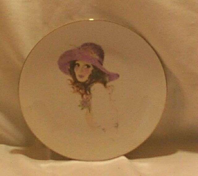 Decorative wall plate, romantic image of younf lady with purple hat