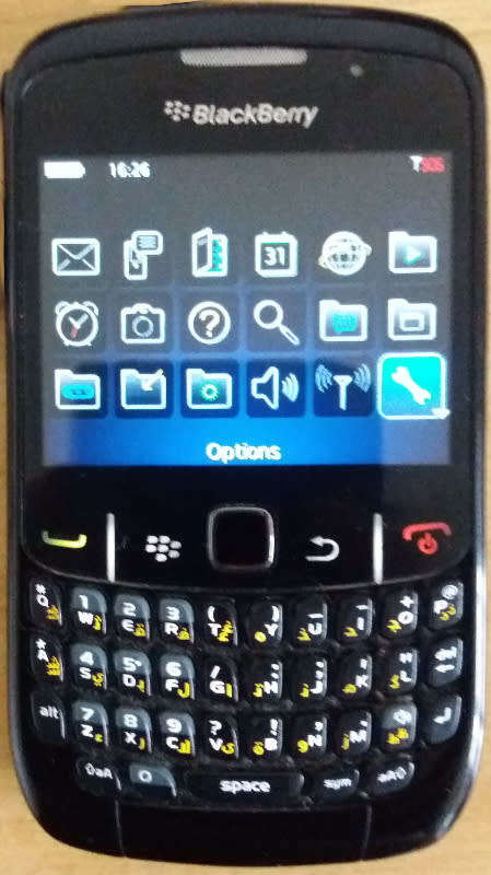VINTAGE BlackBerry 8520 Cell phone with charger, a usb cable and ear phones