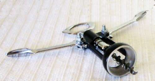 2 Bottle cap openers, 1 cork remover and 1 cork stopper