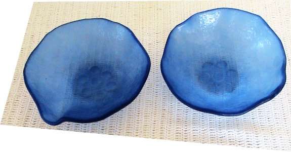 A set of frosted dark blue serving bowls