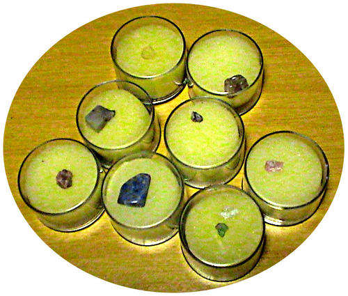 Mixed lot of tiny semi-precious gemstones in display boxes.