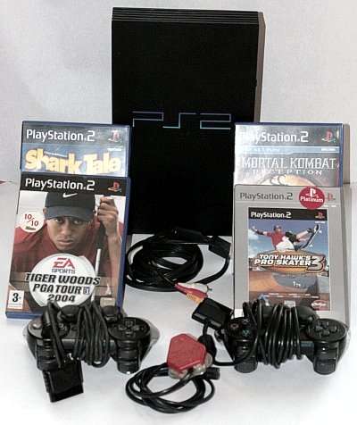 SONY PLAY STATION 2 game console with 2 Contollers and 4 GAMES