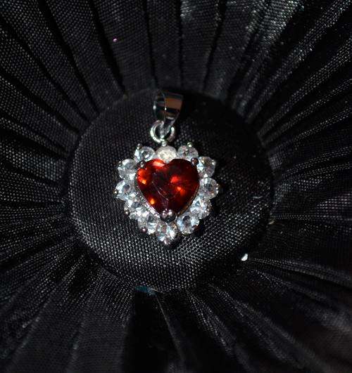 STRIKING HEART TOPAZ SILVER PENDANT. THIS IS A MUST HAVE!