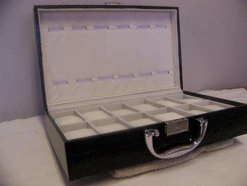 Stitched Black Leather watch case.Holds 24 watches.