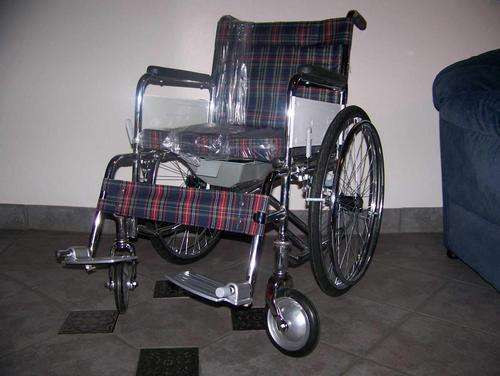 Combination wheel chair and commode.