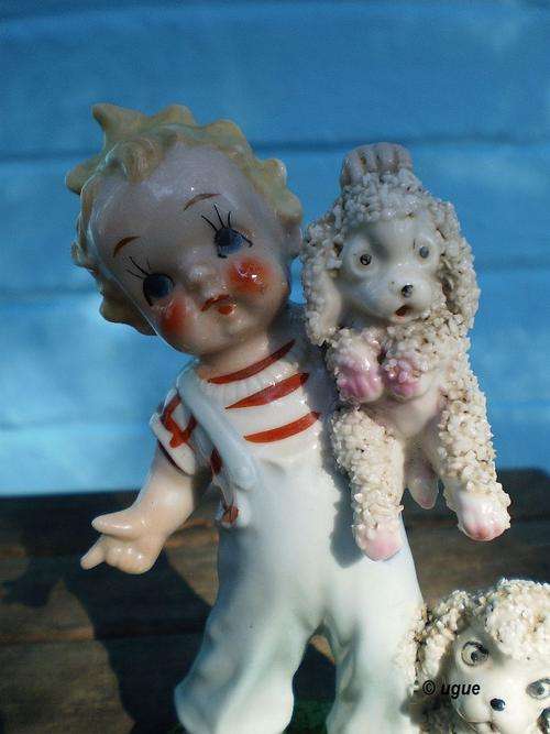 BEAUTIFUL BONE CHINA LAHORE FIGURINE OF A BOY WITH 2 WHITE POODLES