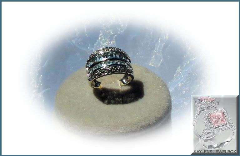 ***9999***ONE IN A LIFETIME!! 9 KT WHITE GOLD WITH DIAMANDS AND TOPAZ STONES! SIZE: 7
