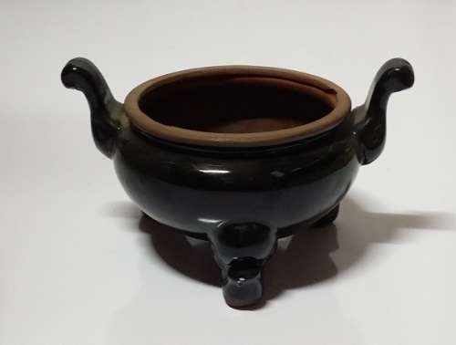 A VINTAGE  POT PLANT  VASE HOLDER