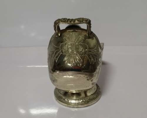 A VINTAGE EMBOSSED  BOWL WITH SCOOP