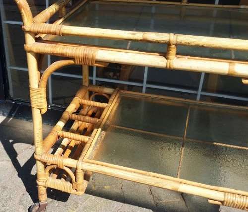A CANE DRINKS TROLLEY ON CASTOR /  WHEELS