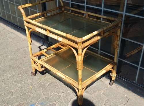 A CANE DRINKS TROLLEY ON CASTOR /  WHEELS