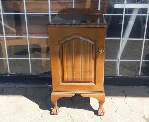 A IMBUIA BALL AND CLAW BEDSIDE  CUPBOARD / BUYER MUST COLLECT IN EDENVALE JHB