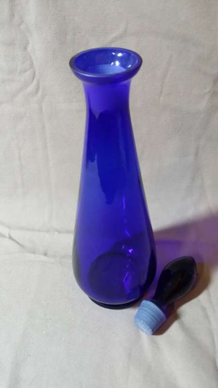 A VINTAGE COBALT BLUE GLASS DECANTER