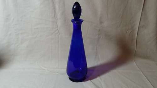 A VINTAGE COBALT BLUE GLASS DECANTER