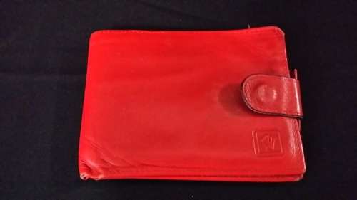 MONTRES ROLEX GENEVA SWITZERLAND LEATHER  RED WALLET IT HAS THE ROLEX LOGO AND CODE ON  IT
