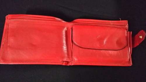 MONTRES ROLEX GENEVA SWITZERLAND LEATHER  RED WALLET IT HAS THE ROLEX LOGO AND CODE ON  IT
