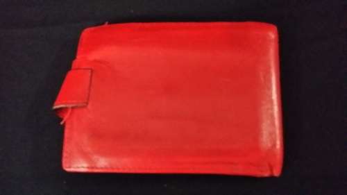 MONTRES ROLEX GENEVA SWITZERLAND LEATHER  RED WALLET IT HAS THE ROLEX LOGO AND CODE ON  IT