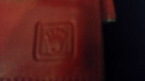 MONTRES ROLEX GENEVA SWITZERLAND LEATHER  RED WALLET IT HAS THE ROLEX LOGO AND CODE ON  IT