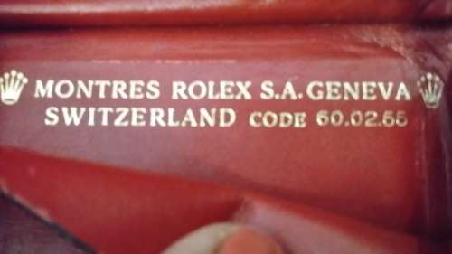 MONTRES ROLEX GENEVA SWITZERLAND LEATHER  RED WALLET IT HAS THE ROLEX LOGO AND CODE ON  IT