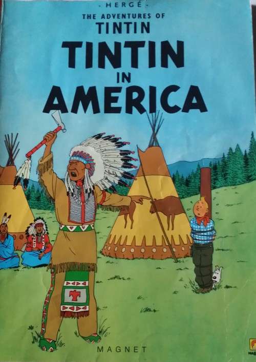 BOOK :  THE ADVENTURES OF TINTIN -  IIN AMERICA - PAPERBACK
