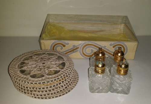 SIX GLASS COATERS WITH CROCHET COVERS AND TWO SETS OF SALT  PEPPER SHAKERS