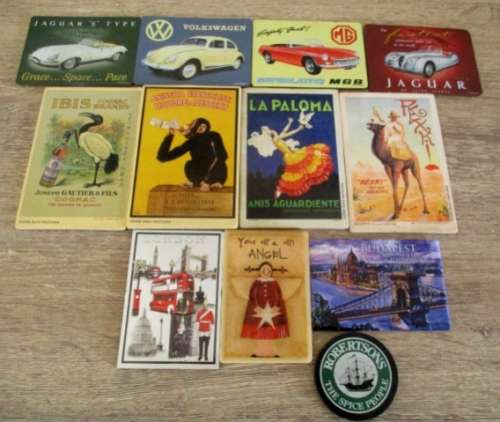 A large collection of 12 old fridge magnets. Different sizes. Different figures.