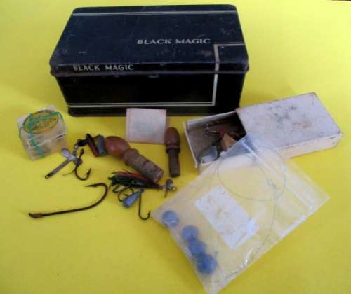 A lot vintage fishing tackle stuff in a very old "Black Magic" tin