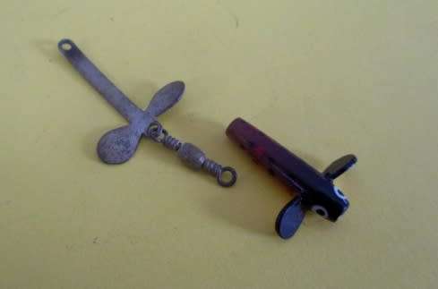 A lot vintage fishing tackle stuff in a very old "Black Magic" tin